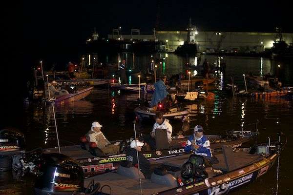 Brandon Palaniuk (foreground) is one of several Elite Series anglers who were busy preparing tackle before the take-off.
