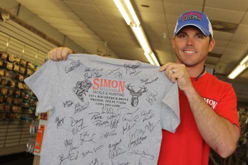 <p>Jonathan Simon of Simon Outfitters collects autographs from Elite Series pros for an upcoming auction to raise funds for a local hospice.</p>
