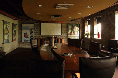 <p>The conference room sports a huge table where editors and producers gather to brainstorm ideas.</p>
