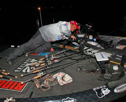 <p>Cliff Crochet leans over to push his boat off Mike McClelland's as the two anglers prepare their gear for Day One of the Ramada Quest on Bull Shoals Lake.</p>
