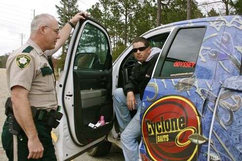 <p>Rather than a traffic stop, Forrest County Deputy Sheriff Tim Hartfield simply wanted to congratulate Pace for winning the Classic. (Note: Professional bass fishing isn't a stress-free job, as evidenced by the big pink bottle of Pepto Bismol in Pace's truck door.)</p>

