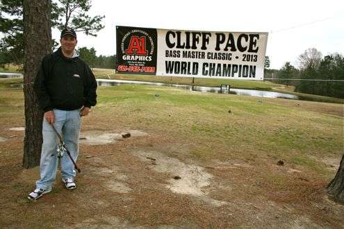 <p>Cliff and his wife, Brana, own a two-story brick house located adjacent to the Twin Pines Golf Course. When they returned from Tulsa, a "welcome home" sign had been strung between two pine trees on the course, behind the Paces' home.</p>
