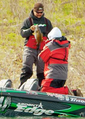<p>Fred Roumbanis swings a nice smallmouth into the boat. </p>
