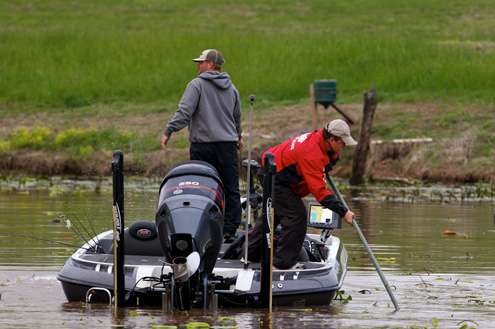 <p>Brandon Mosley and his co-angler work together to access a shallow area. </p> 