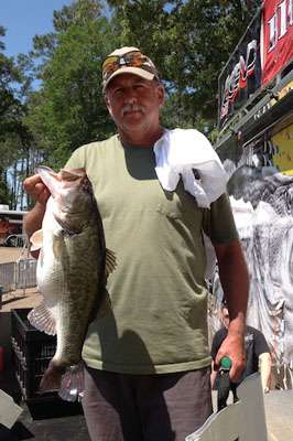 Bruce Davis of Kempener, Texas, weighs in an 8.4-pound bass.