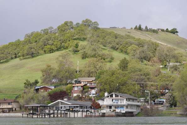 <p> </p>
<p>Clear Lake offers beautiful scenery, such as this hillside, dotted with trees and homes.</p>
