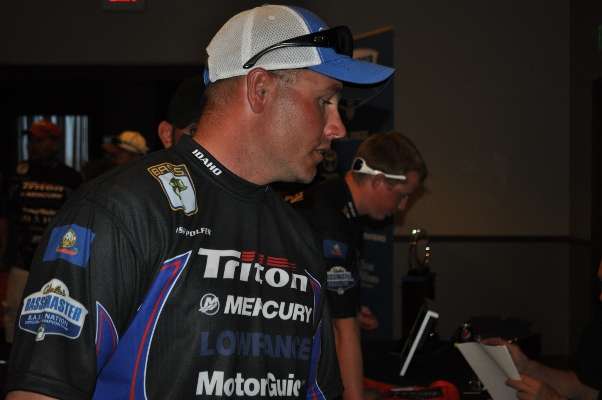 Josh Polfer, who represented the West in the 2012 Bassmaster Classic, goes through registration line.