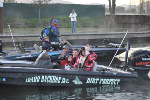 The Idaho Junior Bassmaster anglers wave at the camera on their way out.