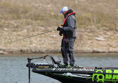 <p>Jeremy Starks keeps an eye on his electronics as he makes his way down the edge of a creek channel on Day One of the Ramada Quest.</p>
