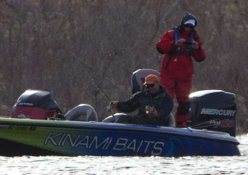 <p>Steve Kennedy pulls a keeper smallmouth into the boat.</p>
