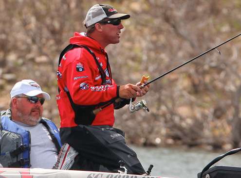 <p>Britt Myers has a quick snack, but doesnât quit fishing. </p>
