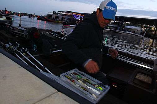 Anglers make last minute tackle preparations for a day of fishing the Red River. 