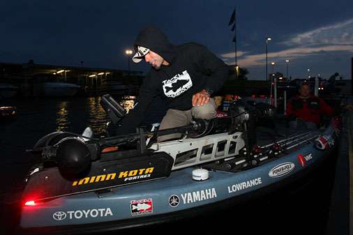 <p>Elite Series Pro Mike Iaconelli double checks his electronics as he prepares for the start of Day Three.</p> 