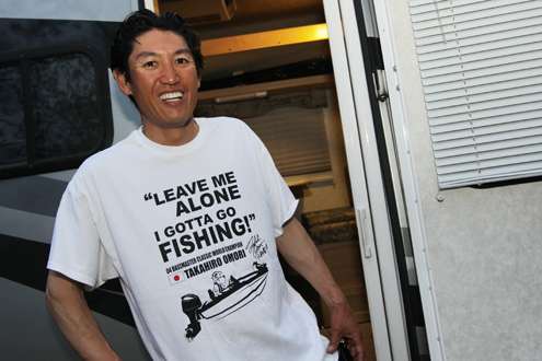 Elite Series pro Takahiro Omori sports one of his newly designed T-shirts after learning of the Day One postponement of the Ramada Quest on Bull Shoals.