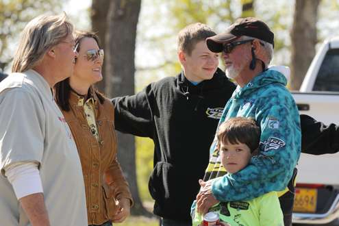 <p>Rick Clunn enjoys his family time after weighing his fish.</p>

