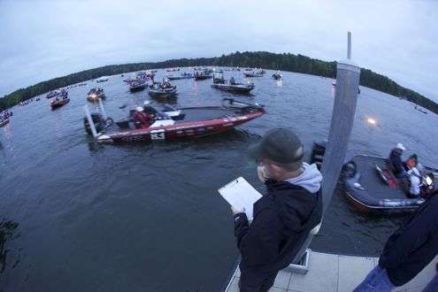 <p>Tournament director Trip Weldon calls out boat numbers so the anglers can get lined up.</p>
