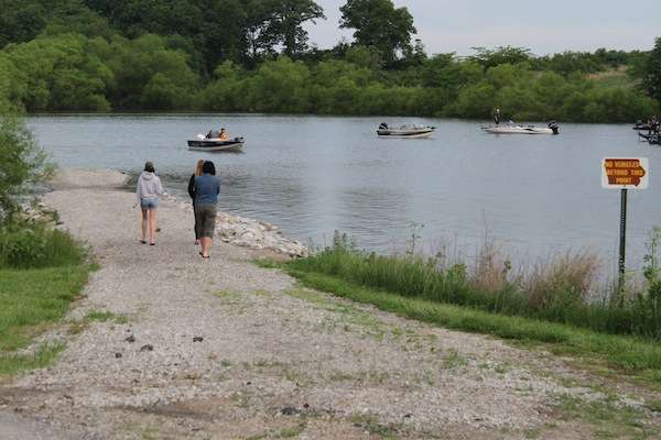 <p>A few friends and family make their way out onto a levy to send their anglers off on Day Two of the 2013 Carhartt College Series Midwest Regional.</p>
