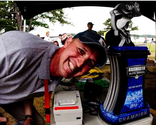 <p>BASS employee Chris Brown hams it up with the West Point champion trophy.</p>
