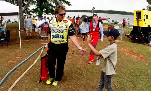 <p>Winning angler Skeet Reese celebrates with a young fan.</p>
