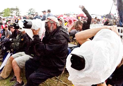 <p>Bassmaster.com photographer James Overstreet kept his camera dry when it began raining during the weigh-in.</p>
