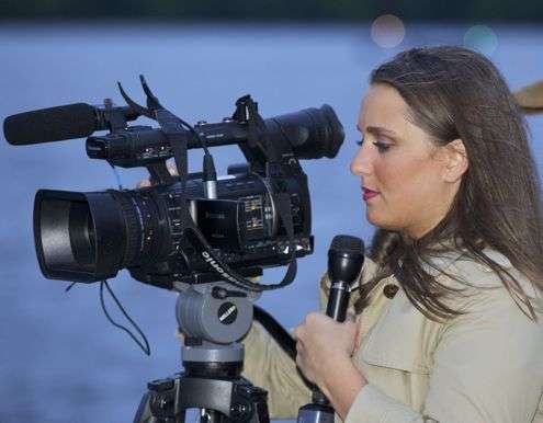 <p> </p>
<p>A local television reporter prepares to tape an interview.</p>
