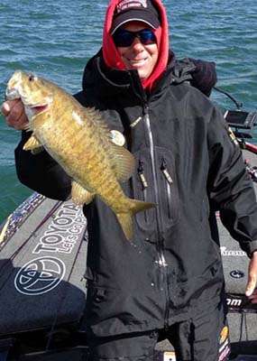 <p>Marshal Lance Roe sent in this casual-looking photo of Kevin VanDam with a nice smallie early on the first day. It appears more like buddies taking photos of each other's catches on a relaxed, recreational fishing outing than a four-time Bassmaster Classic champion competing for another Classic berth and a cool hundred grand.</p>

