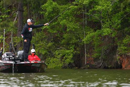 <p>Bradley Roy pitches a drop bait along the clay banks of West Point Lake. </p>
