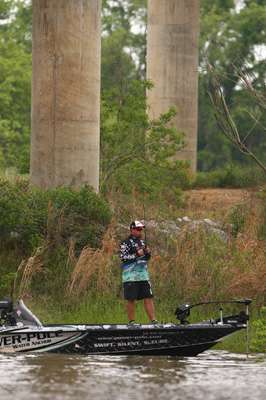 <p>Chris Lane fishes under one of the many bridges that cross the Alabama River.</p>
