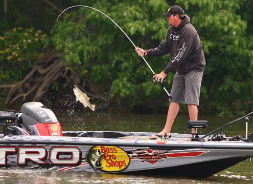 <p>Williams swings a big spotted bass into the boat.</p>
