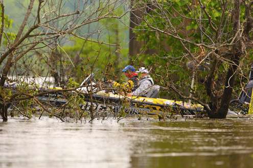 <p>He weaves his way through the flooded trees and boulders to the main river channel. </p>
