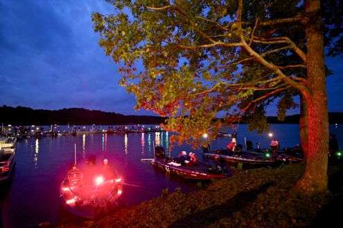 <p>The red lights from Brandon Palaniuk's boat put a glow on the darkness.</p>
