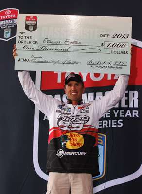 <p>Edwin Evers proudly holds up the bonus check he received from Toyota as the AOY points leader at West Point Lake last week.</p>
