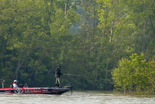 Mike Iaconelli keeps a close eye on his electronics as he eases his boat toward an island point.
