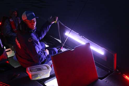 <p>Greg Vinson ties a bait while waiting for the start of Day Three.</p>
