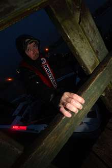 <p>Co-angler Chad Thompson holds the boat near the dock.</p>
