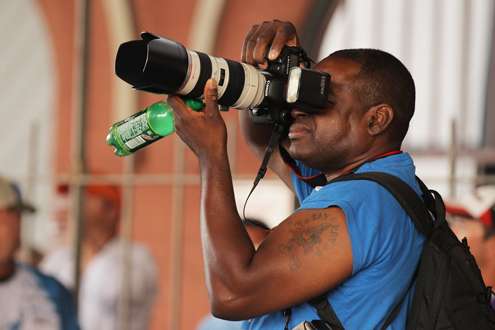 <p>A local photographer works hard with some Mountain Dew in his hand.</p>
