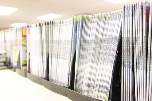 <p>Archive copies of <em>Bassmaster</em> Magazine line the shelves.</p>
