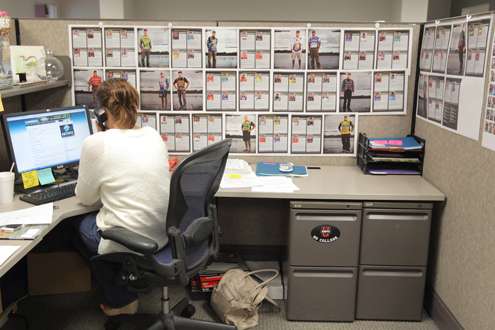 <p>Editorial Assistant Helen Northcutt's wall is filled with angler profiles.</p>
