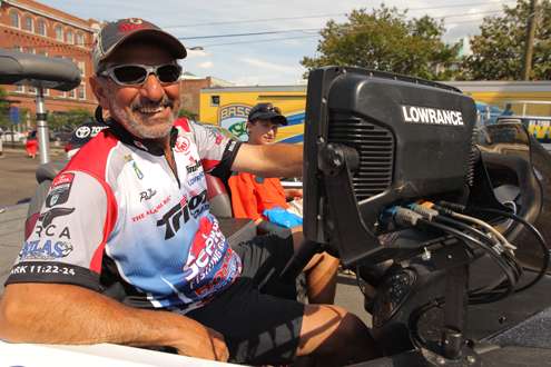 <p>Paul Elias relaxes on his boat, waiting for his turn to  weigh in.</p>

