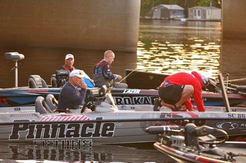 <p>Britt Myers (foreground) and Brent Chapman prepare their tackle prior to the start of the Diet Mountain Dew Mississippi River Rumble.</p>
