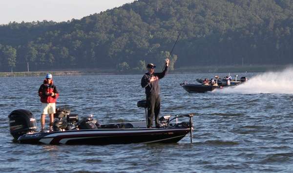<p>Tom Frink of AUM makes his first cast while boats run by. </p>
