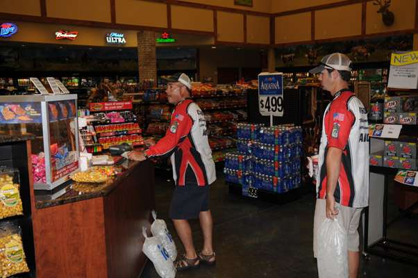<p>Missouri anglers Mark Cowart and Richard Wilson wait to pay for their ice.</p>
