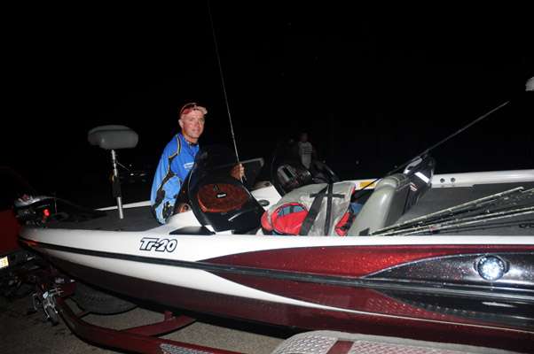 <p>Nick Ash of Nebraska gets his rods ready for Day One.</p>
