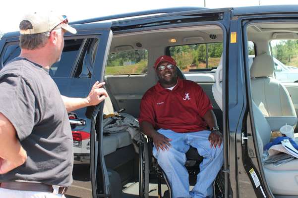 <p>And then outside in the parking lot I meet Lee McClendon Jr., at one time one of the most recruited high school football players in Alabama, but who in his senior year was paralyzed when an 18-wheeler forced his truck off highway but who tells me, "I enjoy life; don't look at me all crippled up. I enjoy life."</p>
