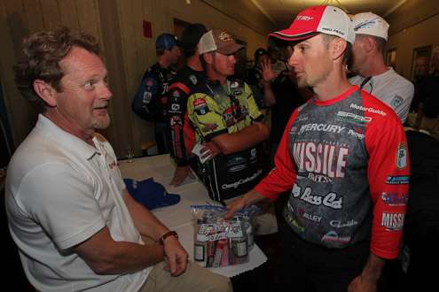 <p>John Crews and David Ittner of Yamaha talk about the upcoming event as Crews waits in line to register.</p>
