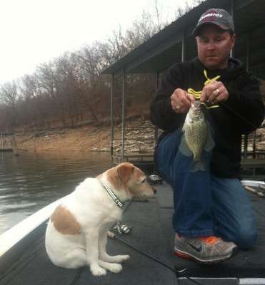<p>Skipper McClelland (kind of) helps Mike reel in a fish.</p>
