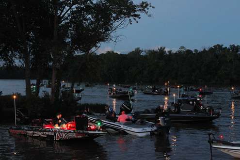 <p>As the first flights blasted off, some anglers continued to work on their tackle.</p>
