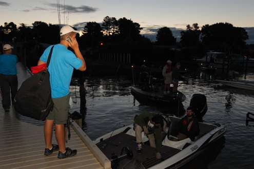 <p>A co-angler gets on the cell phone to locate his pro partner.</p>

