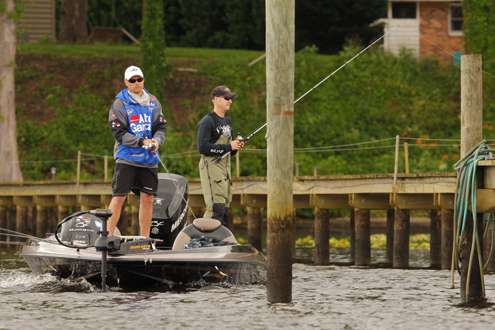 <p>Shane Rees and his co-angler Joshua Adkisson fish around boat dock pilings.</p>
