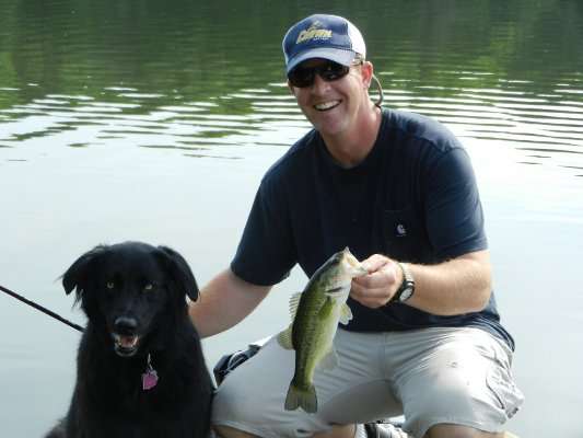 <p>Michael Simonton takes his dog, Brooklyn, fishing with him. "She doesn't care much for fish I catch," said Simonton. "She just likes to swim."</p>
